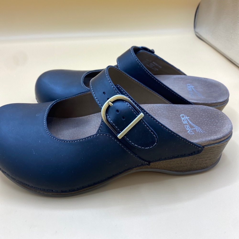 Dansko Black Leather Mules with Gold Buckle